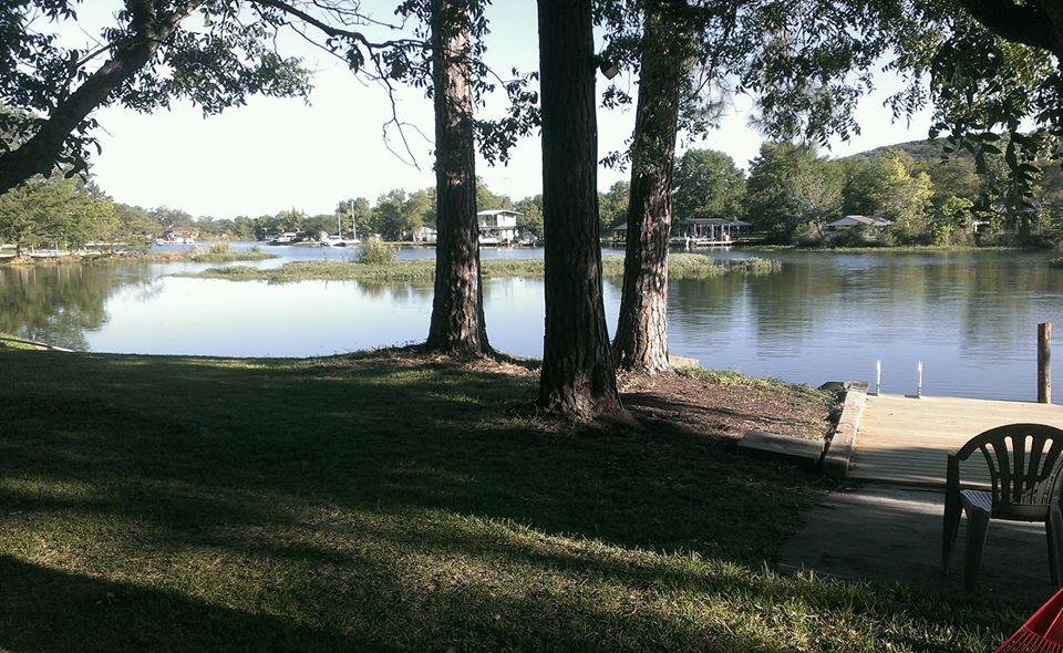 The lawn running down to the dock
